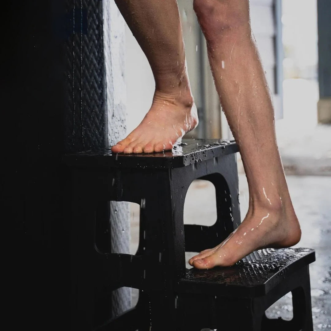 person walking up steps to an ice bath